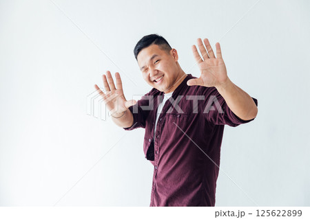 The Asian man winked and smiled 125622899