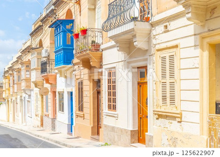 Typical Maltese street with old residential buildings in traditional architectural style, Malta 125622907