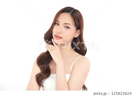 A beautiful young Asian woman with clean, fresh skin against a white background. Skincare, facial treatment, cosmetology, beauty, and spa. An elegant portrait of an Asian woman. A beautiful young Asian woman with clean, fresh skin against a white background. Skincare, facial treatment, cosmetology, beauty, and spa. An elegant portrait of an Asian woman. 125623824
