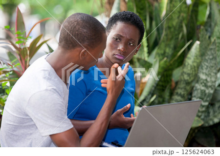 portrait of young students sitting with laptop. 125624063