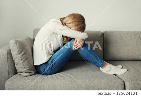 Upset sad crying woman while experiencing mental suffering, depression, fatigue, emotional stress Upset sad crying woman while experiencing mental suffering, depression, fatigue, emotional stress 125624131