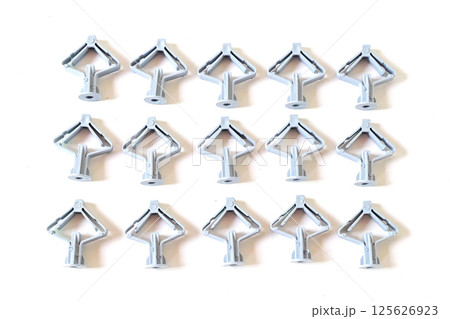 Grey Butterfly type plastic dowel on white background. Grey Butterfly type plastic dowel on white background. 125626923