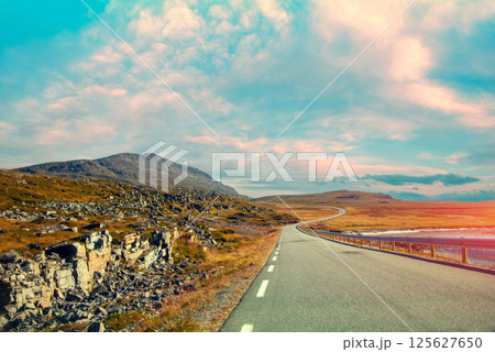 Driving a car on mountain road. Nature Norway. Polar circle. The way to Nordkapp 125627650