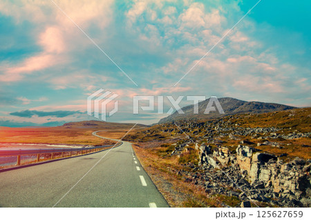 Driving a car on mountain road. Nature Norway. Polar circle. The way to Nordkapp 125627659