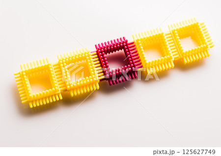 Parts of the children's construction set are joined into unusual structures. The building toy appears on a white background.  125627749