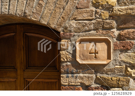 Wooden rectangle sign with the number four in classic brown font Wooden rectangle sign with the number four in classic brown font 125628929