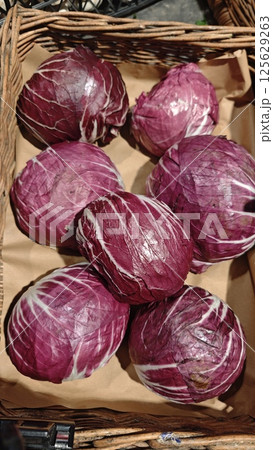 Fresh heads of radicchio with deep red leaves Fresh heads of radicchio with deep red leaves 125629263