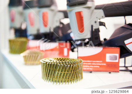 Nails and nail guns in store 125629864