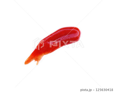 Wet spot smear of red tomato ketchup isolated on white background.  125630418