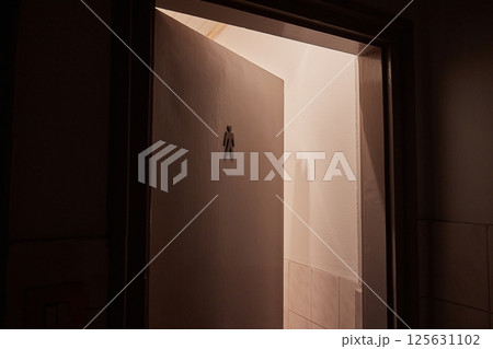 Toilet door left ajar, men's toilet sign Toilet door left ajar, men's toilet sign 125631102