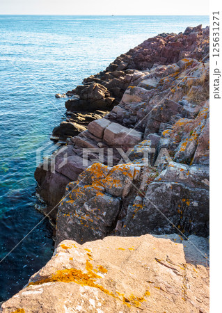landscape with rocky coast at the sea in summer. beautiful view of seascape with shore and blue sky above horizon. scenic seaside of bulgaria in vacation season 125631271