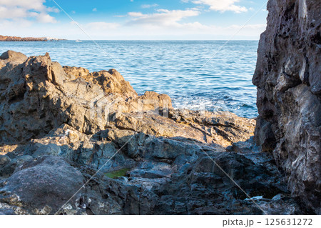 landscape with rocky coast at the sea in summer. beautiful view of seascape with shore and blue sky above horizon. scenic seaside of bulgaria in vacation season landscape with rocky coast at the sea in summer. beautiful view of seascape with shore and blue sky above horizon. scenic seaside of bulgaria in vacation season 125631272
