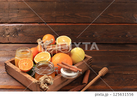 Healthy natural food during flu and colds. Selection of fresh fruits with vitamin C and natural ingredients to strengthen the immune system Organic products to protect against viruses, selective focus Healthy natural food during flu and colds. Selection of fresh fruits with vitamin C and natural ingredients to strengthen the immune system Organic products to protect against viruses, selective focus 125631556