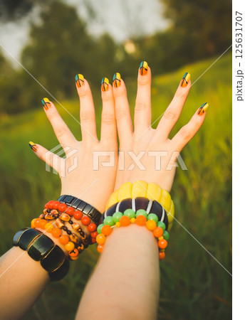 Symbol of peace and pacifism. Beautiful ethnic bracelets on hand. Symbol of peace and pacifism. Beautiful ethnic bracelets on hand. 125631707