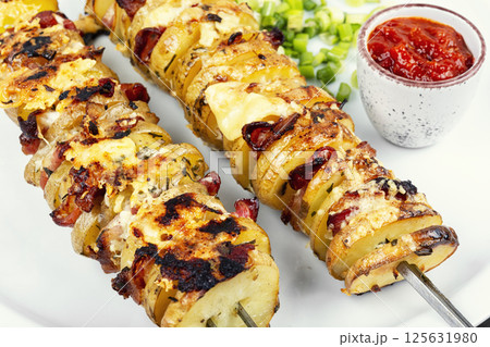 Delicious skewers with potatoes. Delicious skewers with potatoes. 125631980