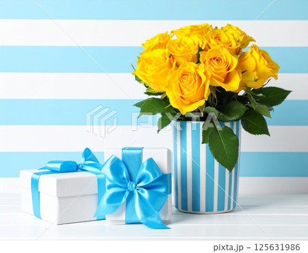 水色と白の縞模様背景に黄色いバラとプレゼント箱の父の日イメージ 水色と白の縞模様背景に黄色いバラとプレゼント箱の父の日イメージ 125631986