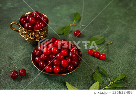 Summer fresh cherry berries on marble green background with leaves, banner for shops, rustic harvest, healthy natural food concept, breakfast with ingredients, cafe business card, selective focus 125632499