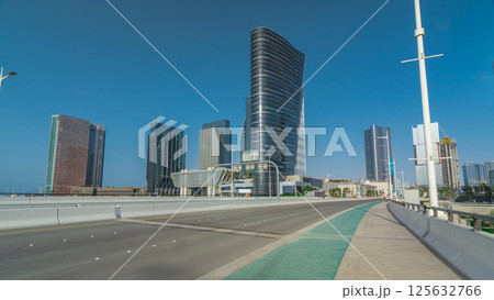 Modern buildings in Abu Dhabi skyline timelapse hyperlapse with waterfront. 125632766