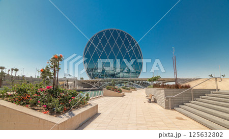 Circular skyscraper Aldar Headquarters Building timelapse hyperlapse in Abu Dhabi, UAE. 125632802