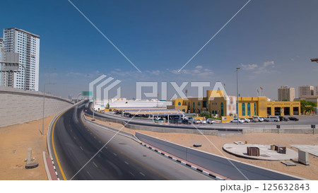 Road traffic in Ajman, view from bridge at day timelapse hyperlapse 125632843