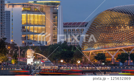 The Esplanade Theatres on the Bay in Singapore at dusk, with beautiful reflection in water day to night timelapse 125632869