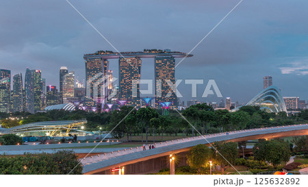 Aerial view after sunset with Singapore city skyline view from Marina barrage garden day to night timelapse. 125632892