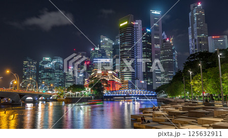 Business Financial Downtown City and Skyscrapers Tower Building at Marina Bay night timelapse hyperlapse, Singapore 125632911