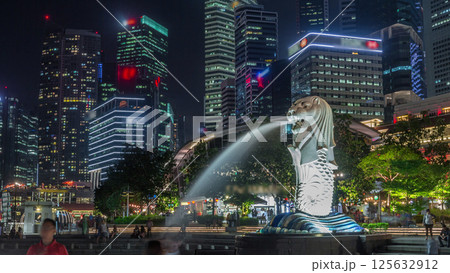 The Merlion fountain and Singapore skyline night timelapse hyperlapse. 125632912