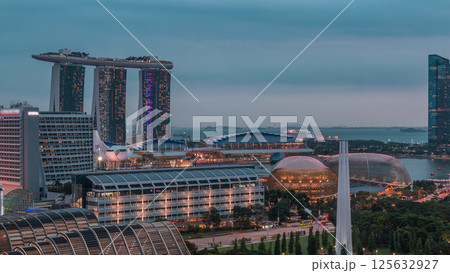 Evening panorama with Marina Bay area and skyscrapers city skyline aerial day to night timelapse. Evening panorama with Marina Bay area and skyscrapers city skyline aerial day to night timelapse. 125632927