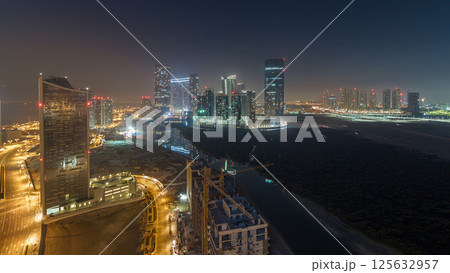 Buildings on Al Reem island in Abu Dhabi night timelapse from above. Buildings on Al Reem island in Abu Dhabi night timelapse from above. 125632957