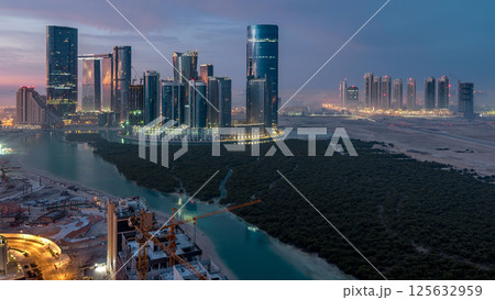Buildings on Al Reem island in Abu Dhabi timelapse from above. 125632959