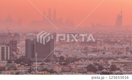 Sunset rooftop view on Dubai Marina with JLT skyline and Jumeirah beach in orange light, Dubai,United Arab Emirates Sunset rooftop view on Dubai Marina with JLT skyline and Jumeirah beach in orange light, Dubai,United Arab Emirates 125633016