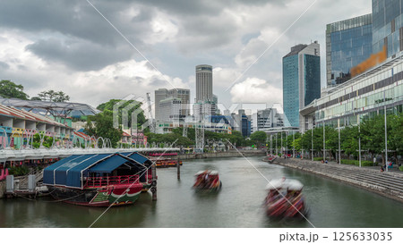 Tourist boats docking at Clarke Quay habour timelapse hyperlapse. 125633035