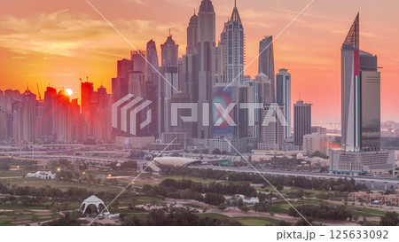 Dubai Marina skyscrapers and golf course sunset timelapse, Dubai, United Arab Emirates Dubai Marina skyscrapers and golf course sunset timelapse, Dubai, United Arab Emirates 125633092