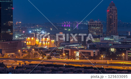 Dubai media city skyscrapers night to day timelapse, Dubai, United Arab Emirates Dubai media city skyscrapers night to day timelapse, Dubai, United Arab Emirates 125633095