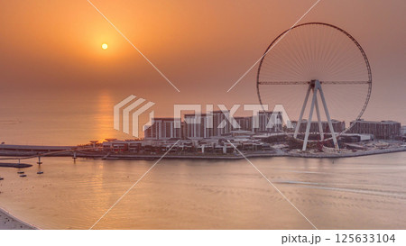 Sunset over Bluewaters Island in Dubai aerial timelapse. Sunset over Bluewaters Island in Dubai aerial timelapse. 125633104