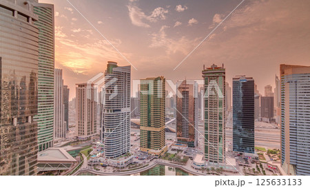 Residential and office buildings in Jumeirah lake towers district timelapse in Dubai Residential and office buildings in Jumeirah lake towers district timelapse in Dubai 125633133