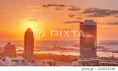 Sunset over Dubai Media City with Modern buildings aerial timelapse, United Arab Emirates 125633149