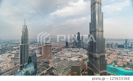 Panoramic skyline view of Dubai downtown with mall, fountains and Burj Khalifa aerial timelapse Panoramic skyline view of Dubai downtown with mall, fountains and Burj Khalifa aerial timelapse 125633168