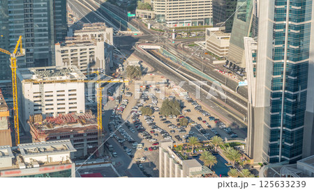 Aerial view of traffic on Business Bay with parking timelapse. 125633239