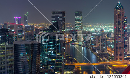 Aerial skyline of Dubai's business bay with skyscrapers day to night timelapse 125633241