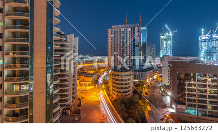 Dubai Marina skyscrapers and promenade aerial night to day timelapse, Dubai, United Arab Emirates Dubai Marina skyscrapers and promenade aerial night to day timelapse, Dubai, United Arab Emirates 125633272