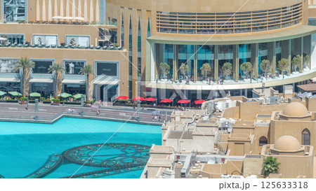 Balcony of shopping mall and pool of fountains timelapse in Dubai, United Arab Emirates 125633318