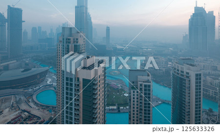 Foggy morning in downtown of Dubai night to day timelapse. 125633326