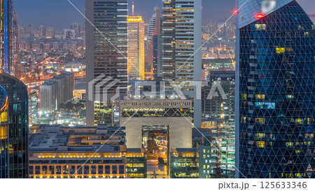 Skyline view of the buildings of Sheikh Zayed Road and DIFC day to night timelapse in Dubai, UAE. 125633346