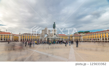Triumphal arch at Rua Augusta and bronze statue of King Jose I at Commerce square timelapse hyperlapse in Lisbon, Portugal. Triumphal arch at Rua Augusta and bronze statue of King Jose I at Commerce square timelapse hyperlapse in Lisbon, Portugal. 125633362
