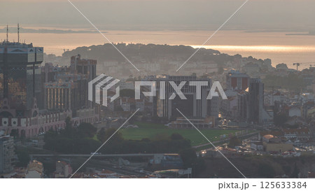 Panoramic overview during sunrise over Lisbon from a viewpoint in Monsanto morning timelapse. Panoramic overview during sunrise over Lisbon from a viewpoint in Monsanto morning timelapse. 125633384