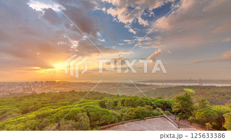 Panoramic sunrise view over Lisbon and Almada from a viewpoint in Monsanto morning timelapse. Panoramic sunrise view over Lisbon and Almada from a viewpoint in Monsanto morning timelapse. 125633386
