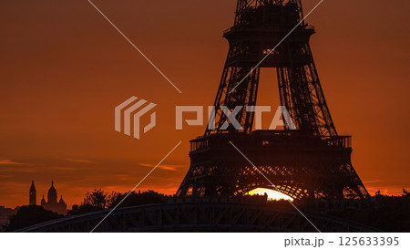Eiffel Tower sunrise timelapse with boats on Seine river and in Paris, France. Eiffel Tower sunrise timelapse with boats on Seine river and in Paris, France. 125633395