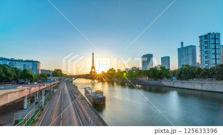 Eiffel Tower sunrise timelapse with boats on Seine river and in Paris, France. 125633396